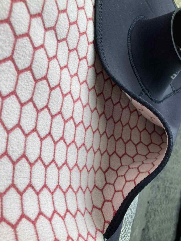 Red and white fleece lining inside fourth element wetsuit