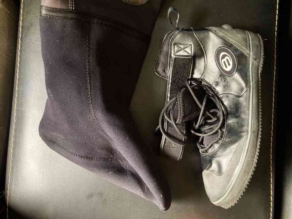 A Pair of integrated drysuit socks with a pair of drysuit boots
