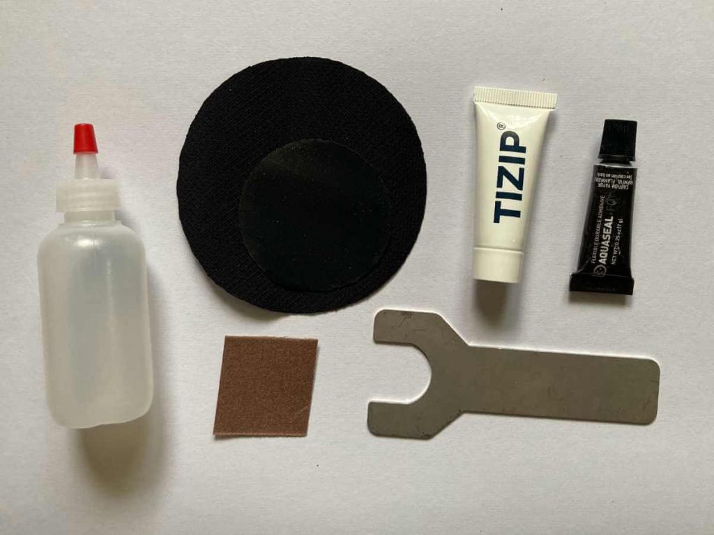 Tools, patches and glue for fixing drysuits