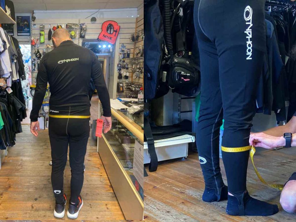 A man being measured in a dive shop (Aquanaught London) for drysuits
