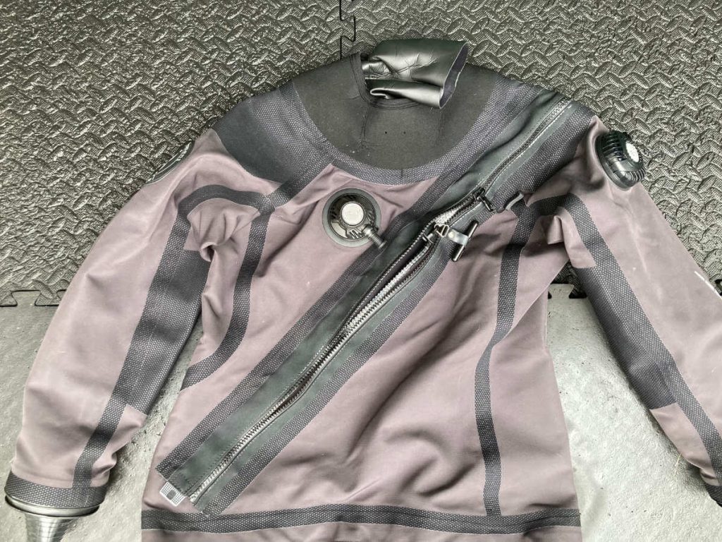 A Fourth Element drysuit with zipper running from shoulder to opposite hip