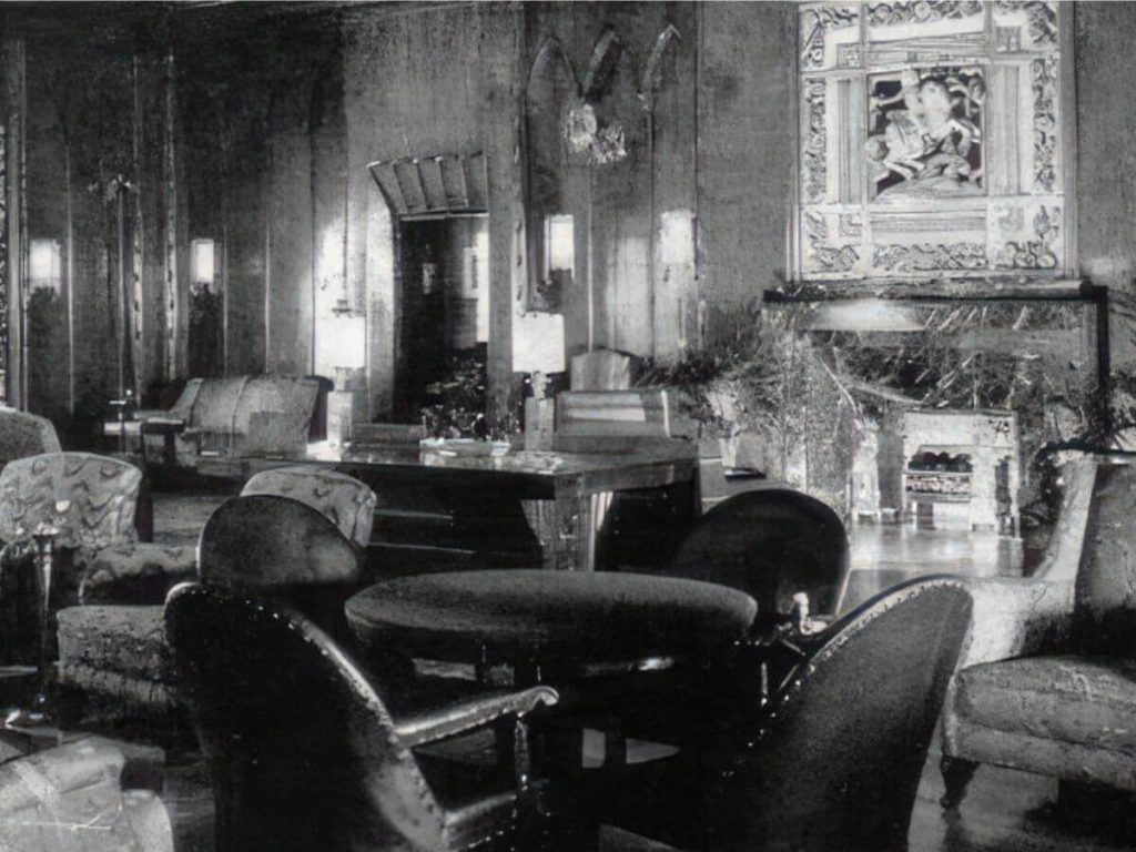 The empty smoking room on the S.S. President Coolidge with the infamous 'Lady & The Unicorn' porcelain statue in the background
