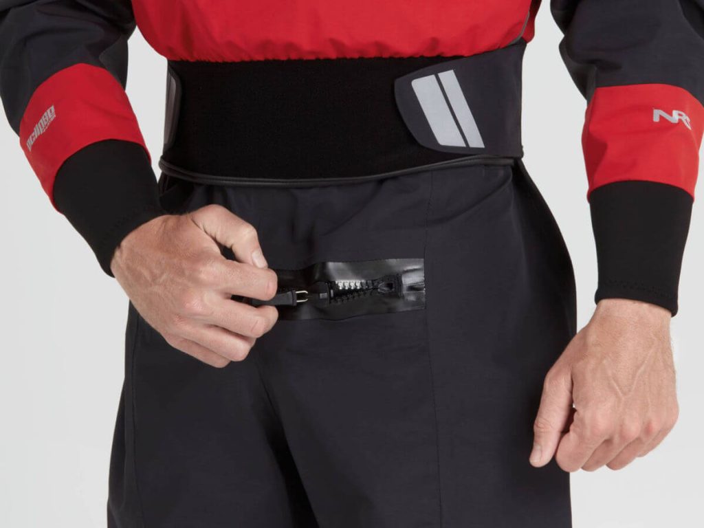 A Man pulling a drysuit zipper accros the waist