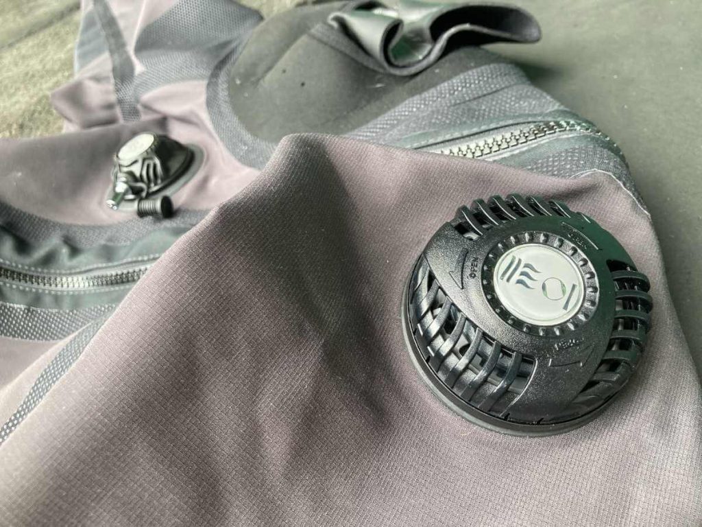 A drysuit exhaust valve on the shoulder