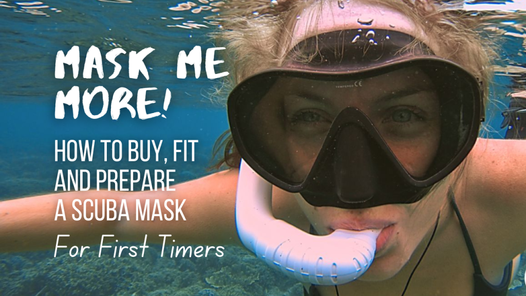 Woman in a black scuba mask with a white snorkel