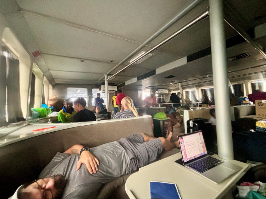 Man sleeping in the first class section of Big Sista Ferry