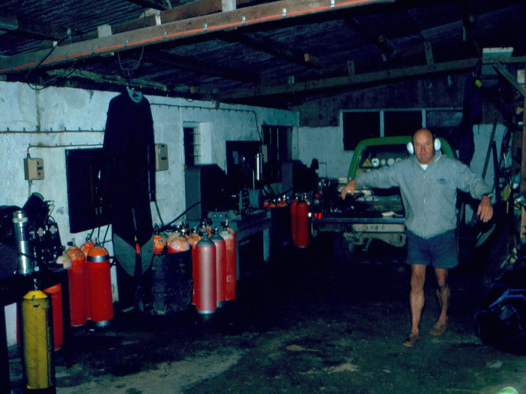Allan Power pumping scuba tanks in his garage