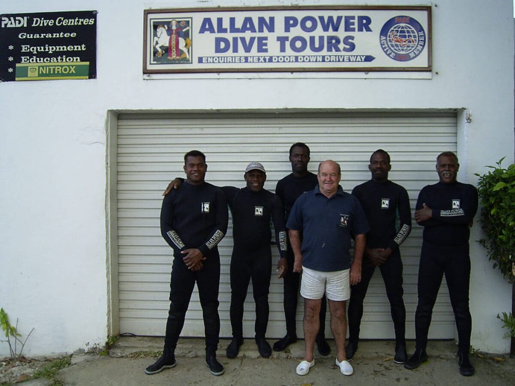 Allan Power with his team of Ni-Van dive masters in front of his shop in Luganville
