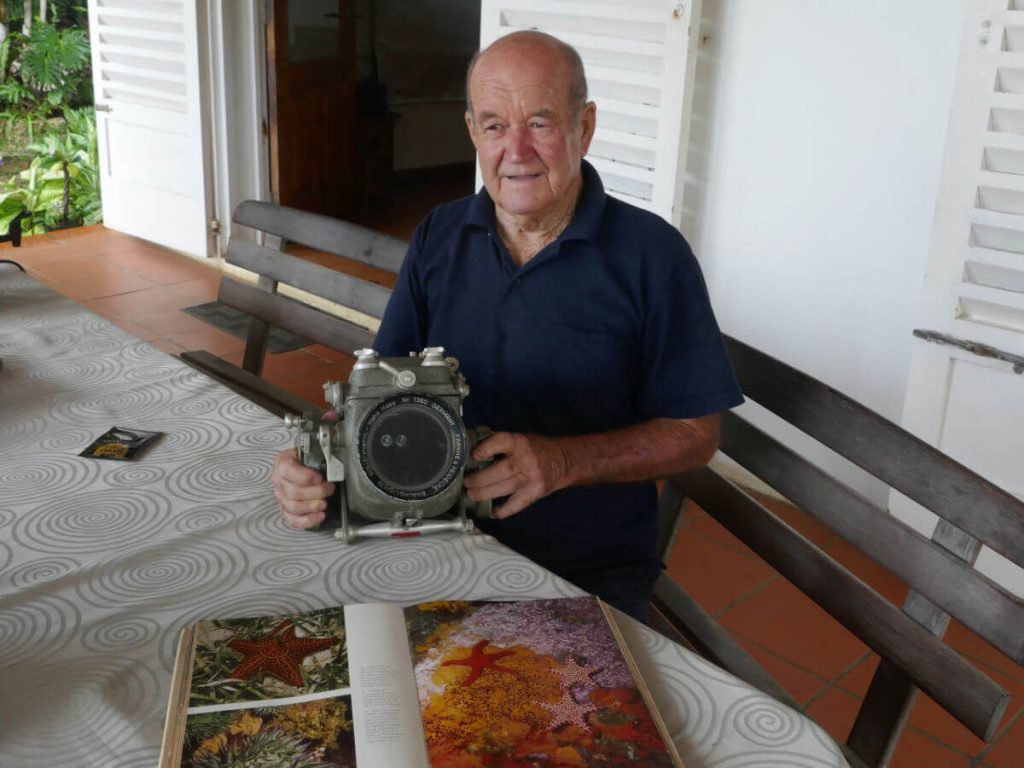 Allan Power with his first underwater camera and photos he took with it