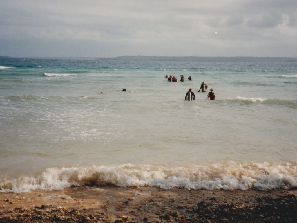 Divers from Allan Power Dive Tours shore entry to the SS President Coolidge