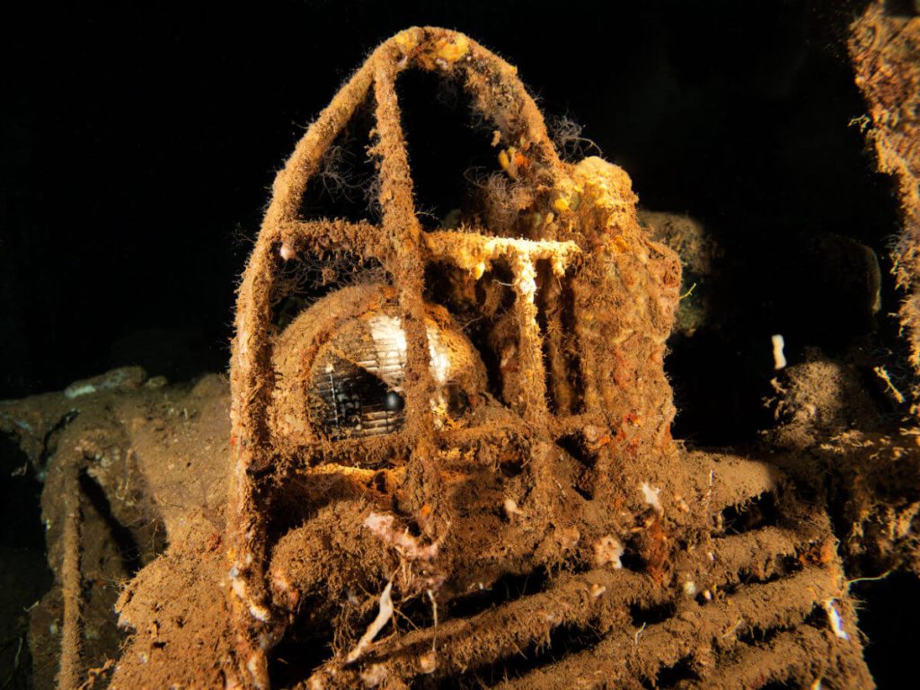 WWII Willys jeep headlight from inside cargo hold 1 on the ss president coolidge in Espiritu Santo, Vanuatu