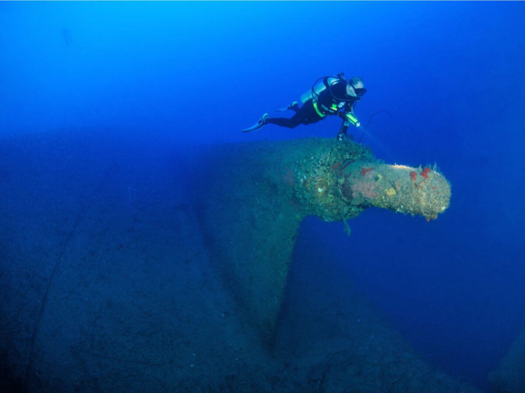 Diver on the Stern of the SS President Coolidge in Espiritu Santo, Vanuatu