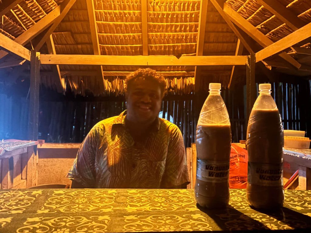 Drinking kava in Vanuatu out of 1.5 liters bottles instead of shells